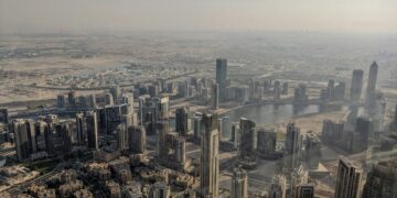 Aerial view of Dubai city buildings.